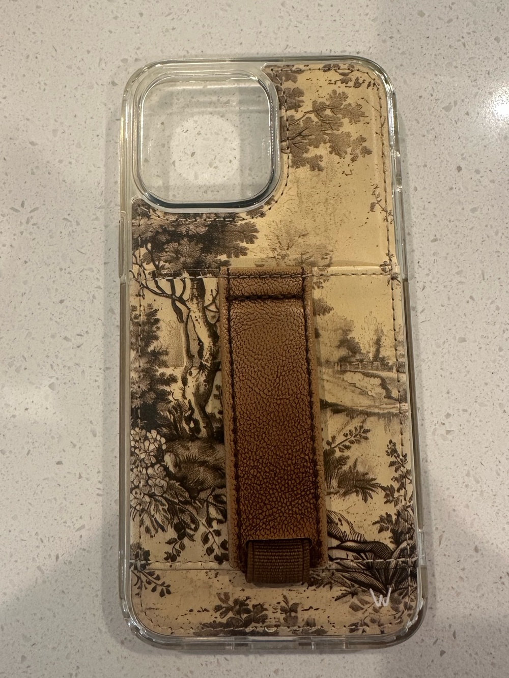 Walli Case with Brown Leather Hand Strap and Scenic background iPhone 14 ProMax